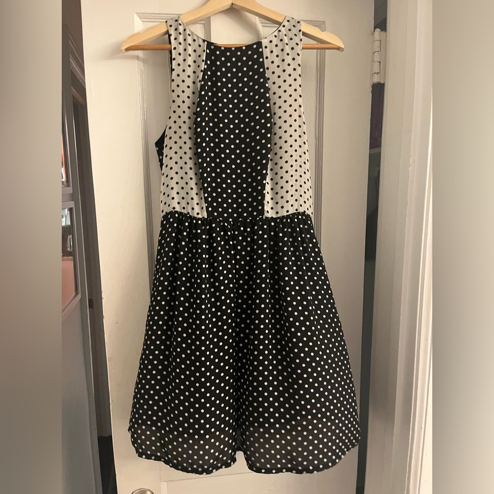 Vintage-inspired black and white polka dot dress